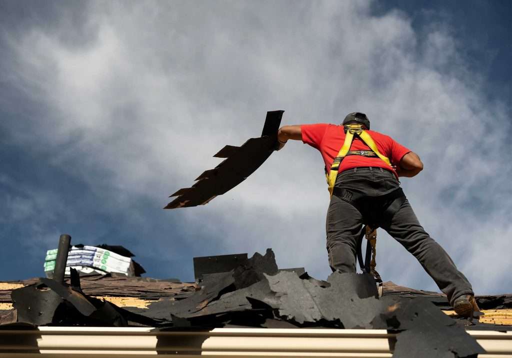 Red Rock Roofing contractor fixing hail damage